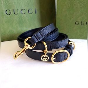Gucci, black leather leash with gold hardware